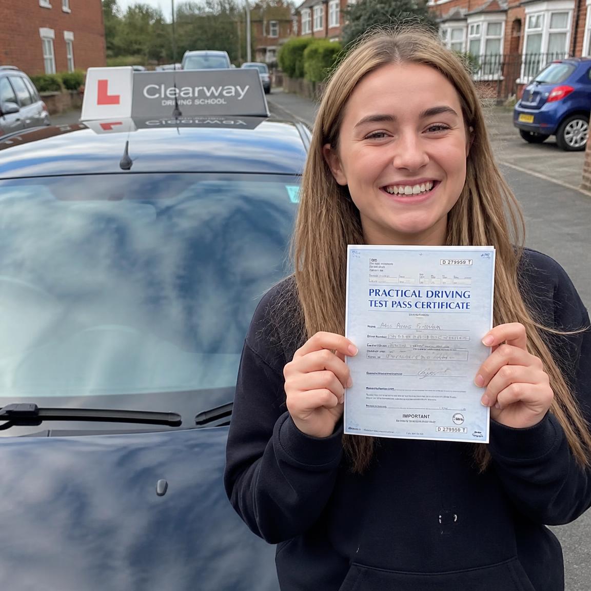 Learner celebrating passing driving test